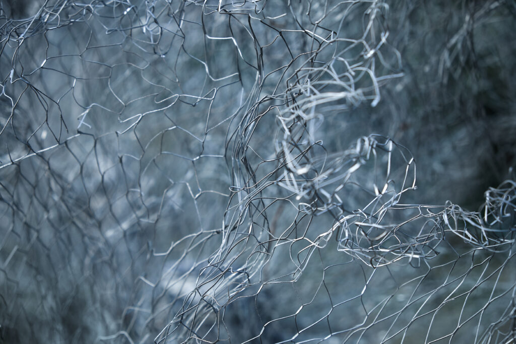 crumpled-wire-net-abstract-background-selective-2022-10-12-18-19-28-utc