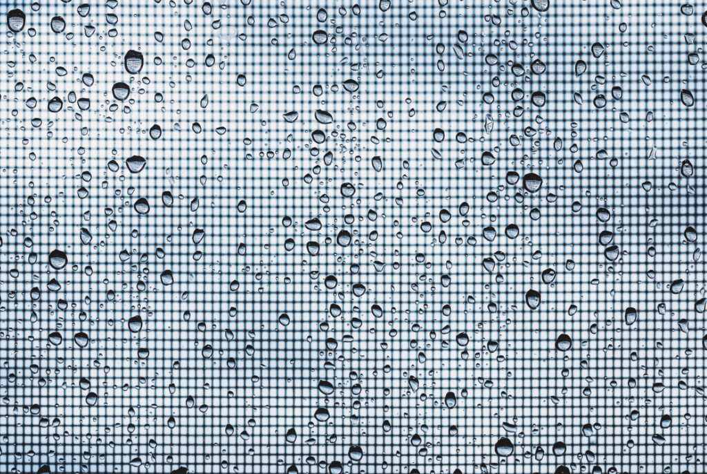 water-drops-on-glass-window-with-mosquito-net-agai-2023-04-03-20-49-58-utc