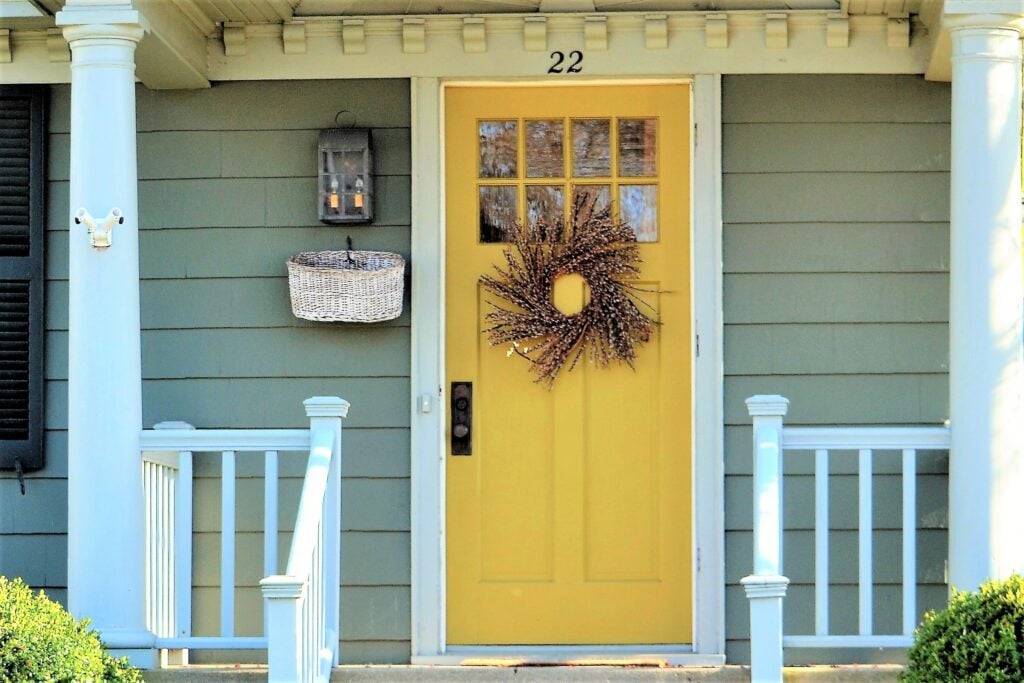 welcoming-front-door-entrance-painted-a-bright-yel-2022-11-16-06-14-02-utc