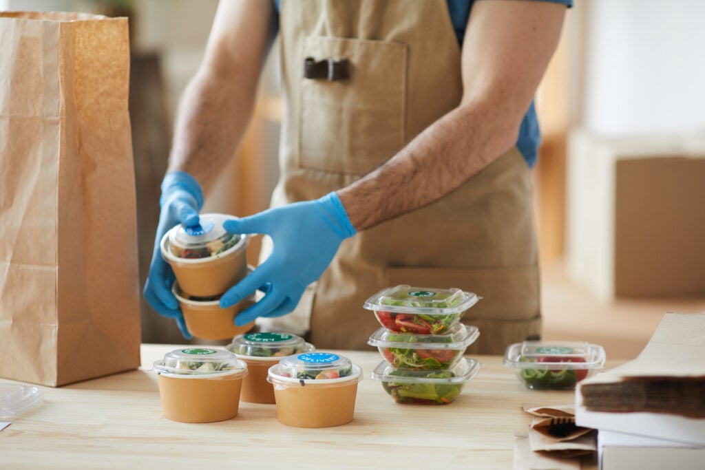 worker-wearing-gloves-at-food-delivery-service-2022-02-02-03-56-42-utc