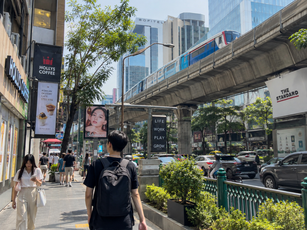 People are walking on Sukhumvit road, under BTS Phrom Phong